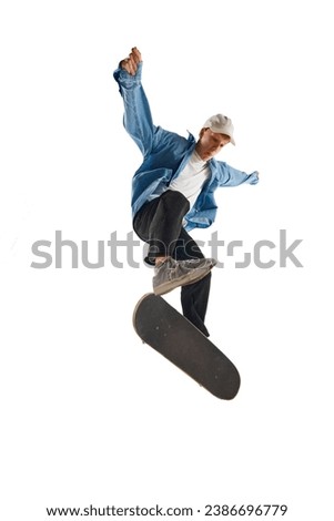 Dynamic image of young man in casual clothes in motion, training, skateboarding isolated over white background. Concept of professional sport, competition, training, action. Copy space for ad