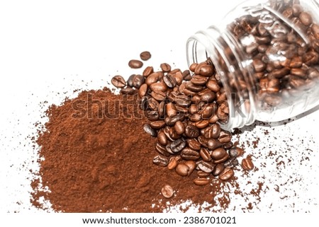 Coffee beans spread over the powder of coffee in white background. isolate picture style.