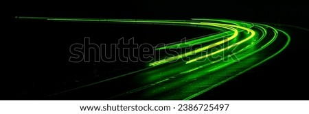 green car lights at night. long exposure Royalty-Free Stock Photo #2386725497