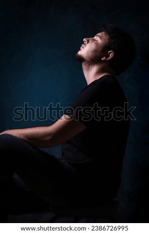 Male depression. Upset Asian young man got problem sitting alone at home, a lot of thoughts, break up with a lover or financial difficulties and debt Overthinking Unhappy unsatisfied and trouble idea. Royalty-Free Stock Photo #2386726995