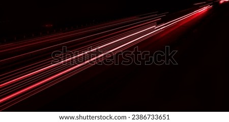 lights of cars driving at night. long exposure Royalty-Free Stock Photo #2386733651