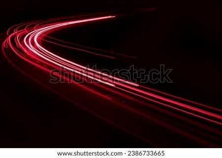 lights of cars driving at night. long exposure Royalty-Free Stock Photo #2386733665