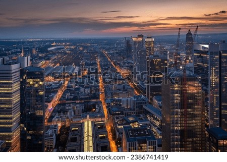 Evening aerial view of the centre of Frankfurt am Main with its skyscrapers and streets with lights