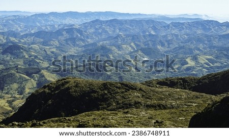 Background consisting of Atlantic Forest in Serra da Mantiqueira's mountain range, on the way to Marins Peak. Piquete, Sao Paulo, Brazil Royalty-Free Stock Photo #2386748911