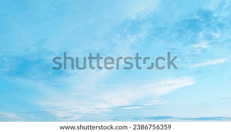 Beautiful blue sky atmosphere and white clouds of various shapes with sunlight. Nature background  Royalty-Free Stock Photo #2386756359