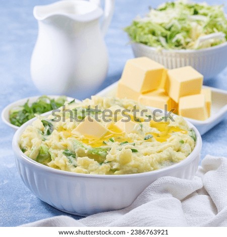 Delicious homemade Irish dish Colcannon or mashed potato with green cabbage and butter, square