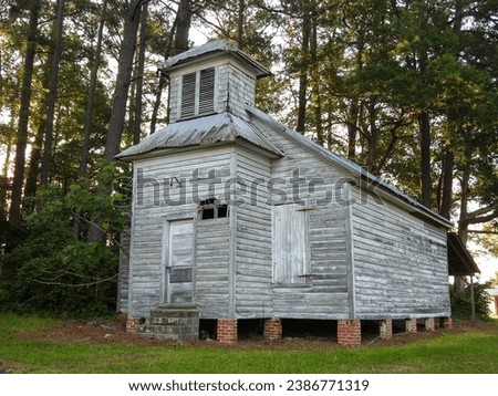 Old Abandoned Wooden Church in the Woods of a Small Rural Community Royalty-Free Stock Photo #2386771319