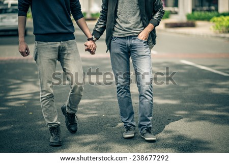 Cropped image of gay couple holding hands Royalty-Free Stock Photo #238677292