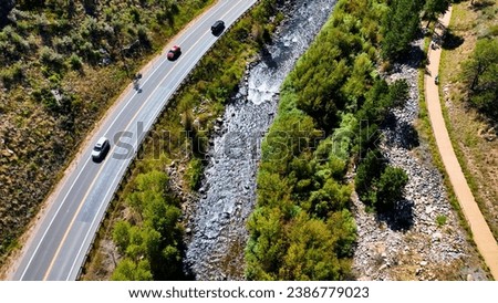 Aerial drone photo of highway in mountain in Colorado. Drone photo of river, highway and riding trail on a sunny day near Black Hawk Colorado.