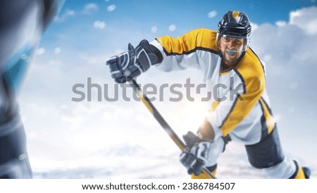 Sport emotion. Hockey close up. Hockey action. Professional hockey players playing hockey on a rink in mountain