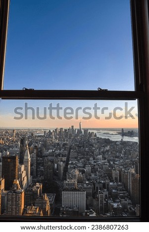 Window View of New York City Skyline from the Empire State Building at Dusk