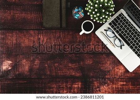 Top view desk office workspace and laptop and supply equipment with empty copy space for freelance working productive workplace area or home office flat lay background.