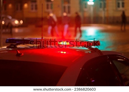 police car lights at night city street, closeup
