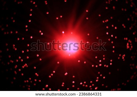 Abstract background - red flash and flying glowing particles