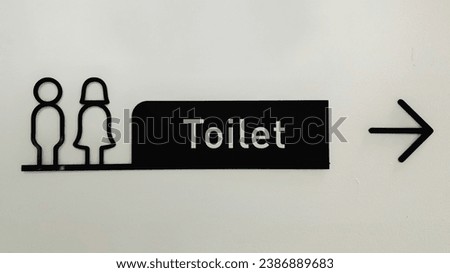 black Toilet Sign arrow to Right with white background 
