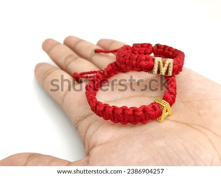 Handmade gold alphabet initial crochet bracelet isolated on white