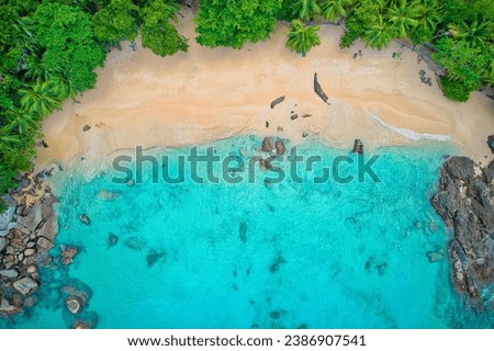 Bird eye drone photography of tourist in the beach, swimming and snorkelling, granite rocks, turquoise and transparent water, near the shore, sunset beach, Mahe, Seychelles  Royalty-Free Stock Photo #2386907541