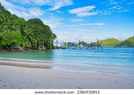 Sunny, white sandy beach, huge granite rocks at Baie Lazare beach, Mahe, Seychelles1 Royalty-Free Stock Photo #2386910853