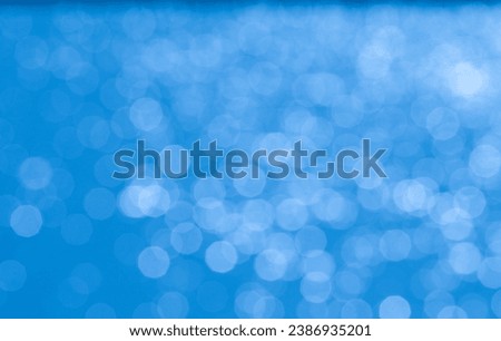 Sparkling ball bokeh on blue background