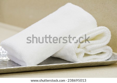 towel rolls in toilet of a hotel