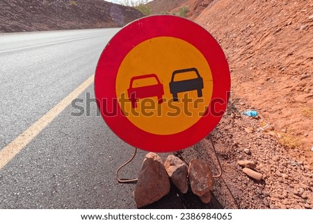 No Overtaking Traffic Sign on the Road