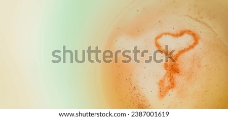 Heart shape in a coffee cup with blurred background