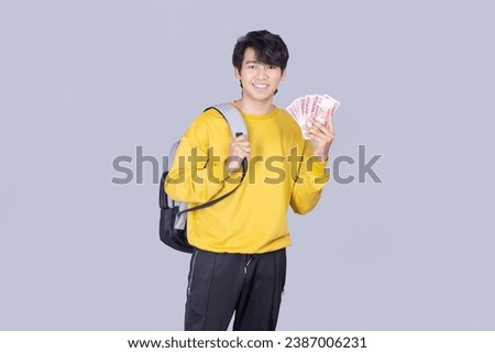 Asia Myanmar Boy with yellow dress Holding money  Royalty-Free Stock Photo #2387006231