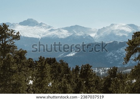 Beautiful Snowy mountains and trees of Colorado during sunset