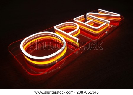 The LED sign is open. Production of advertising for business. Neon sign of the store opening.