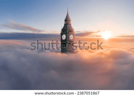 Big Ben clock tower, London, England, UK in clouds with golden hours, sun, sunrise, sunset. A view of the popular London landmark.   Royalty-Free Stock Photo #2387051867