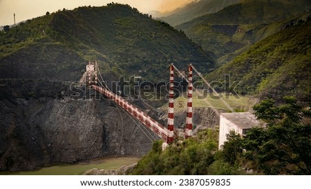Suspension bridge over backwaters of Tehri dam in Uttarakhand. Royalty-Free Stock Photo #2387059835
