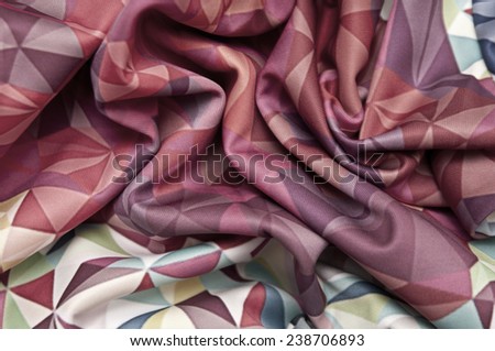 Abstract background fabric texture with the image of geometric shapes with pleats