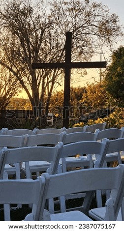 wedding ceremony with the Cross in the background