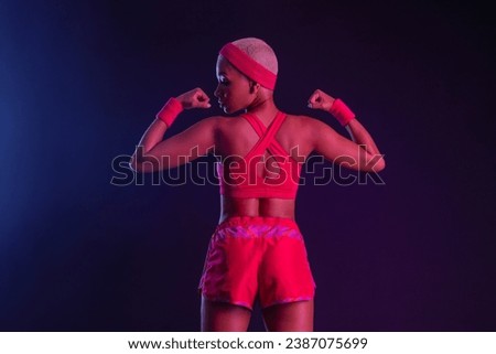 Sporty fit woman, athlete make fitness exercises on neon background. Download cover for music collection for fitness classes. Sports recreation. Beautiful black young woman.