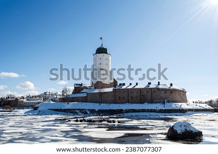 Vyborg Castle
Beautiful view of Vyborg Castle on a sunny winter day. The main tower of St. Olaf is illuminated by bright rays of the sun. 
Vyborg, Leningrad Region, Russia, Royalty-Free Stock Photo #2387077307