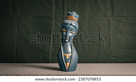 Small statue bust of a woman  Royalty-Free Stock Photo #2387078853