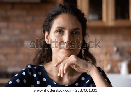 Head shot portrait confident young woman looking at camera, making video call to friends or relatives, popular influencer blogger shooting vlog, mentor coach recording webinar, profile picture Royalty-Free Stock Photo #2387081333