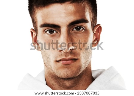 Portrait, serious and man in hoodie for fashion isolated on a white background. Confident young person, face of model and stylish clothes, casual and cool facial expression in Spain on a backdrop