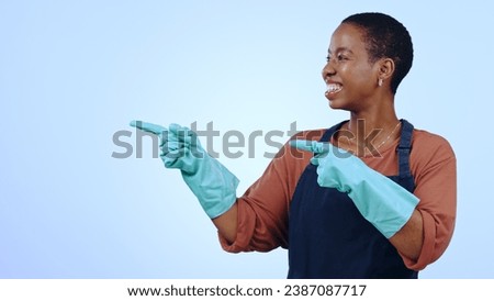 Woman, happy and pointing for cleaning in studio with glove, announcement or advertising space. Black person, face and smile for marketing, showing deal or discount with hand and confidence on mockup