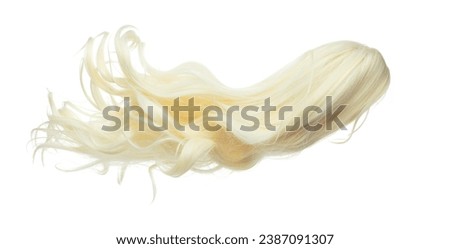 Wind blow long wavy curl Wig hair style fly fall. Gold Blonde woman wig hair float in mid air. Long straight Curly wavy golden wig hair wind blow cloud throw. White background isolated detail motion Royalty-Free Stock Photo #2387091307