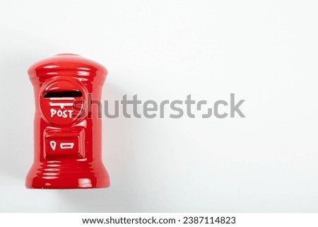 Model of a red round mailbox