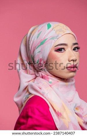 Asian women in casual outfit with hijab over studio background. Happy and smiling young women.