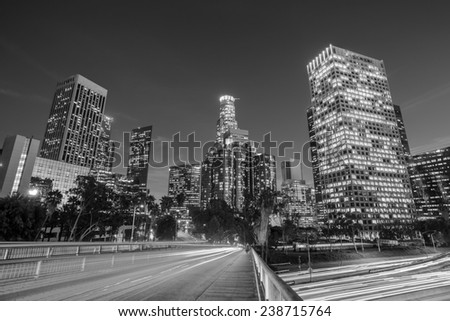 Downtown Los Angeles skyline during rush hour at sunset black and white 