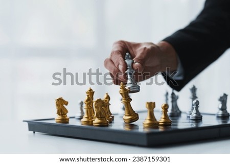 Businessman's hands move chess figures and checkmate opponent during match. Strategy, management, business planning, disruption and leadership concepts analyze development for organizational success.