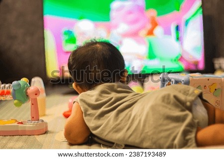 Baby Looking Television In Bedroom, background for advertisement and wallpaper in relaxation corner and home scene. Actual images in decorating ideas