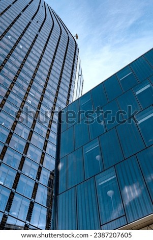 Dynamic high rise glass fronted British architecture, a business district on the south bank of the River Thames in London, capital city of the United Kingdom. 