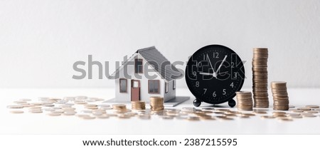 House with money. Concept of finance or refinance real estate. Symbol of house stands against background of us dollars. Property investment. Home mortgage loan rate. Saving money for retirement.