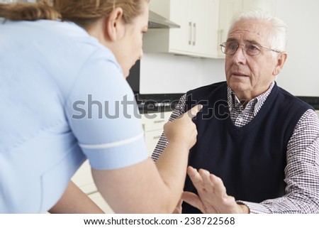 Care Worker Mistreating Elderly Man Royalty-Free Stock Photo #238722568