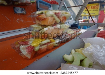 photo of pieces of fresh fruit in a motorbike sales box
