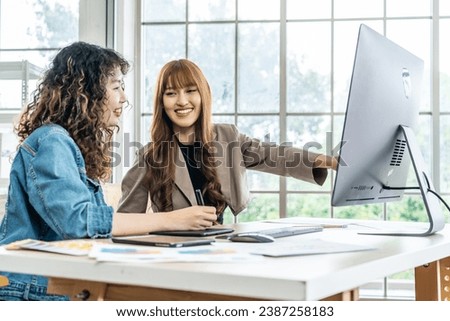 Collaboration of graphic design business people with computer in an office company. Two corporate women in creative marketing team working on project management, Designer teamwork, web design